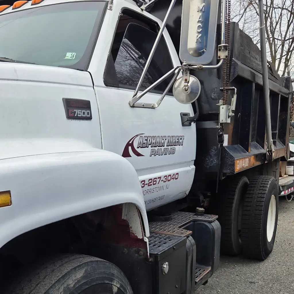 Asphalt Direct Paving, Dover, NJ, work truck with lettering on the side door.