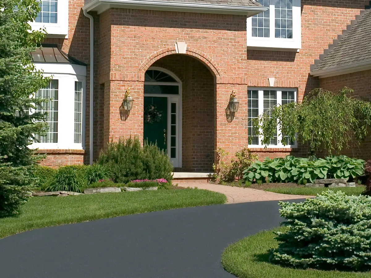 Asphalt paved circular driveway. Stock image used for Asphalt Direct Paving, Dover, NJ.